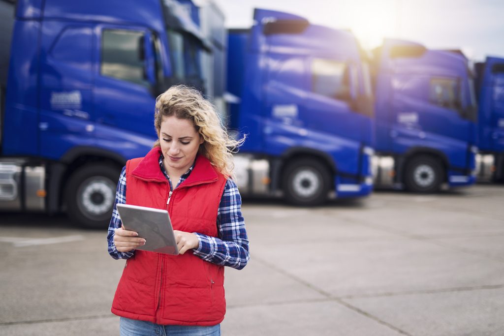 Truck driver holding tablet