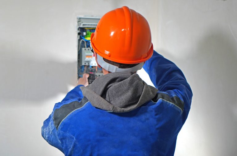 Electrician works with the electrical shield.