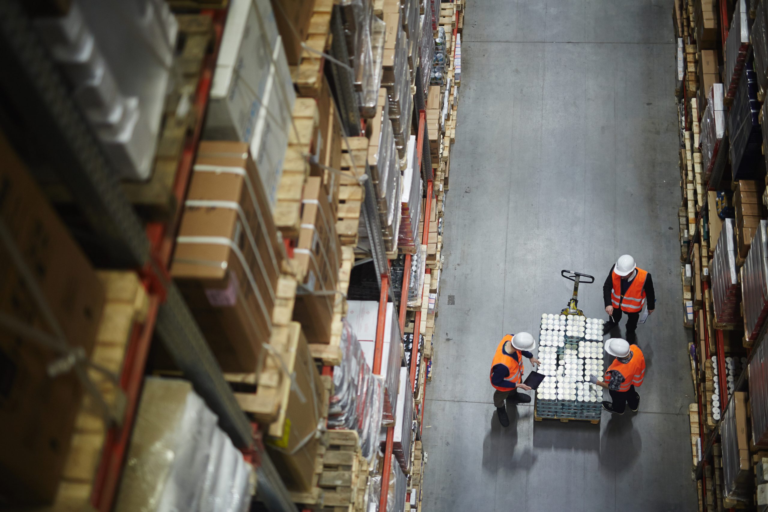 Workers Counting New Shipment in Warehouse