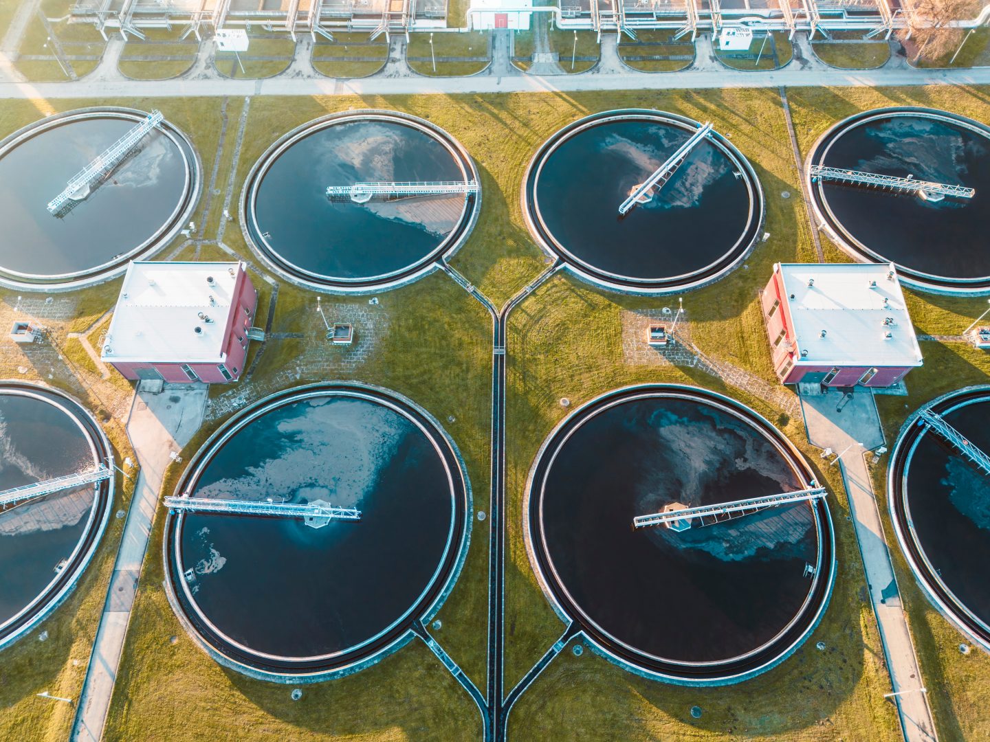 Sewage treatment tanks in green landscape