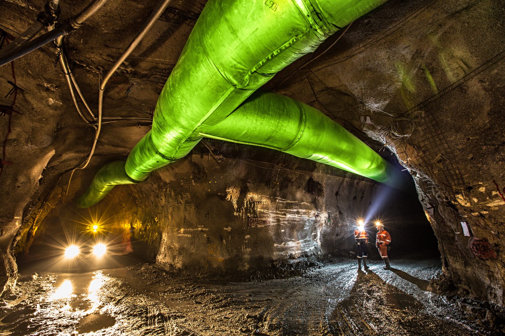 Miners inspecting an underground ventilation system in a gold mine in Australia
