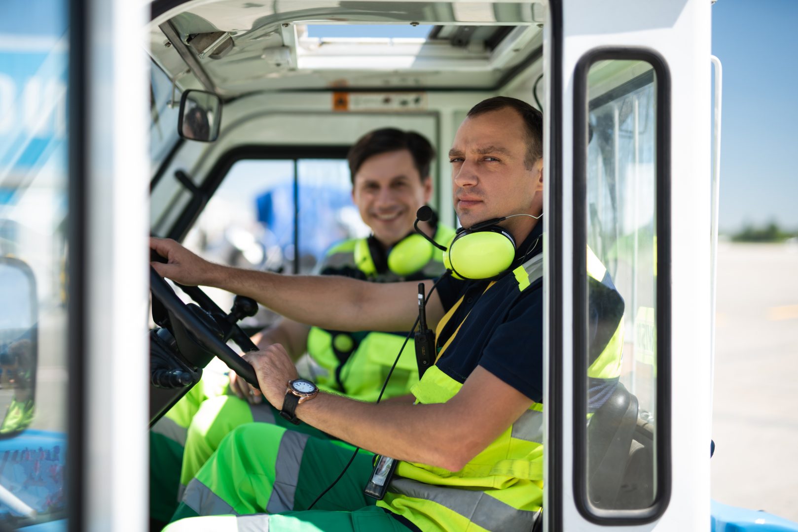 Airport workers sitting in the car